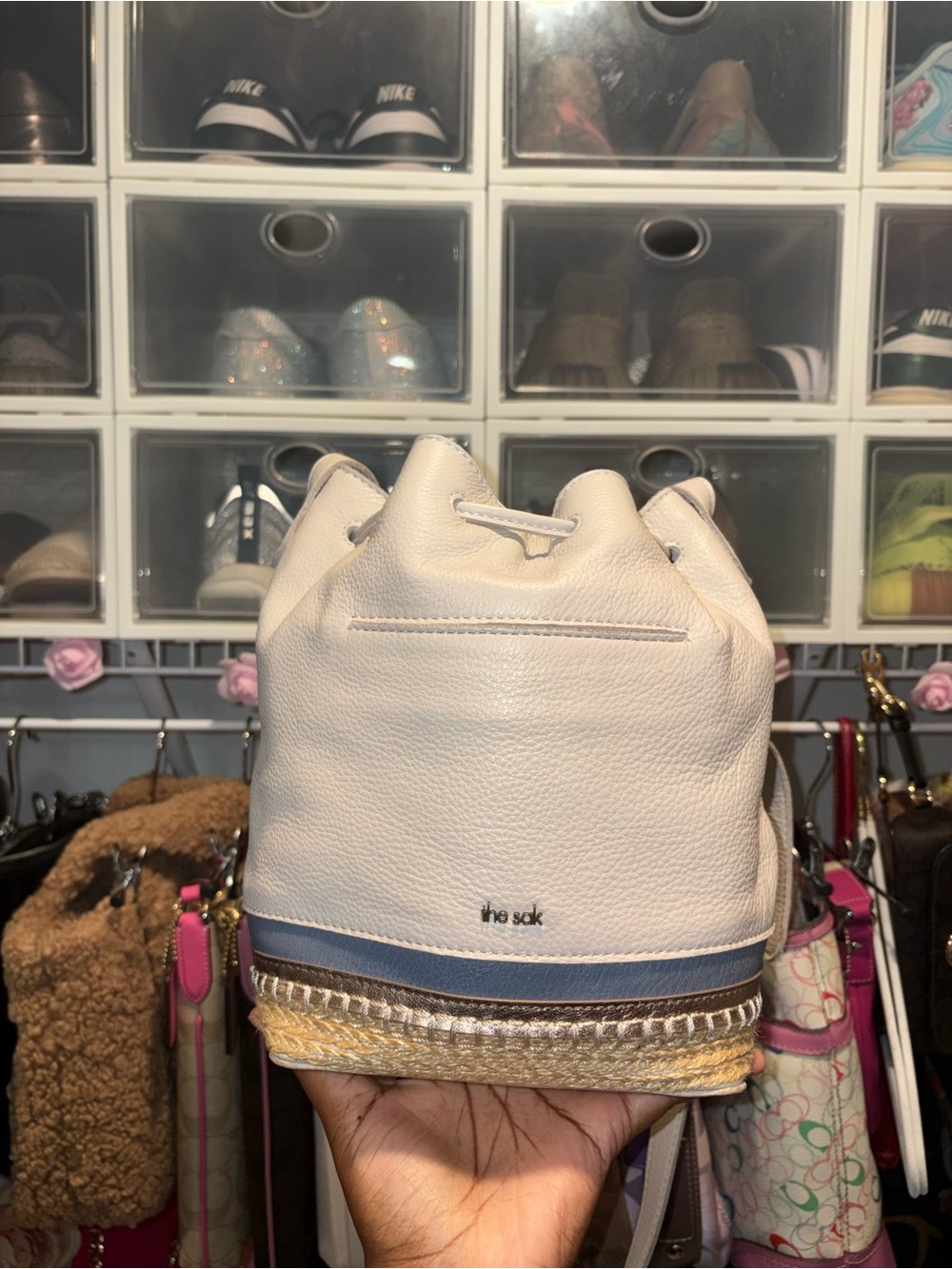 The Sak Cream Leather Mini Drawstring Bucket Bag with Blue Trim